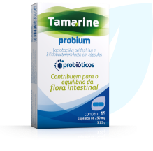 Embalagem segurada por uma mão do produto Tamarine Probium, contendo 15 cápsulas de 250mg. Com uma ilustração de folha atrás da embalagem.